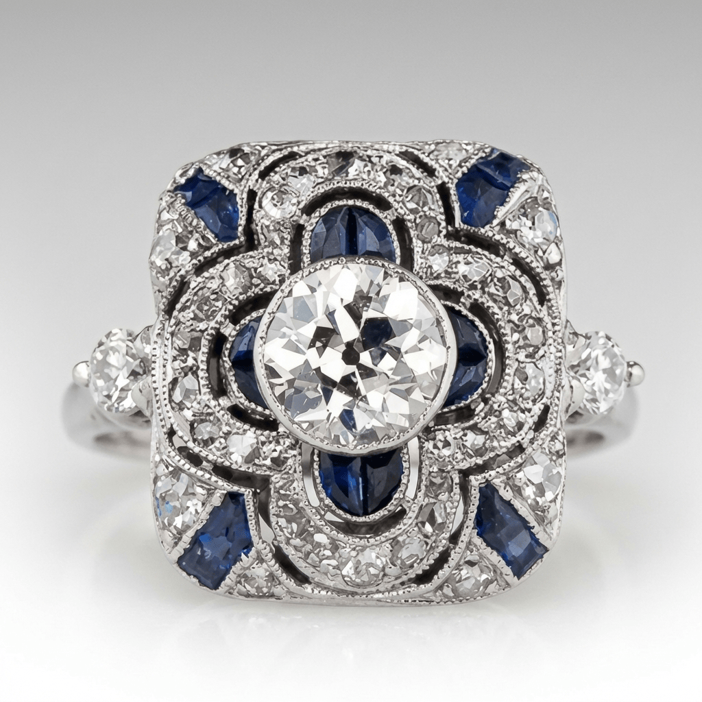 Anel vintage de prata com diamantes e safira azul, design elegante da marca Rose & Oliver, destaque na imagem.