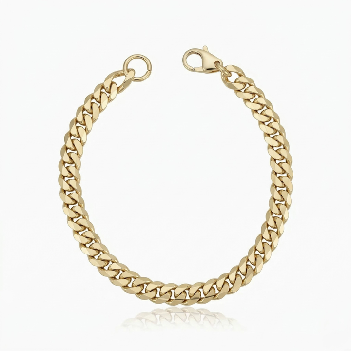 Pulseira cubana Estate Cuban em ouro da Rose & Oliver, detalhe de elos largos e acabamento brilhante.